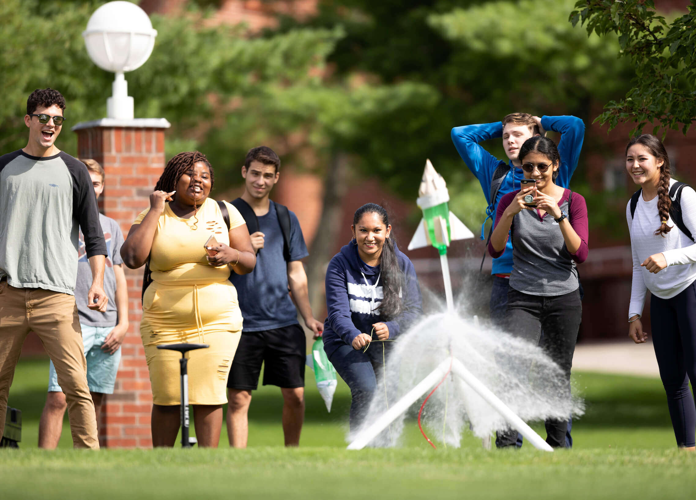 First-year engineering students launch water-bottle rockets into the air during class outside the Center for Communications and Engineering on Quinnipiac's Mount Carmel Campus