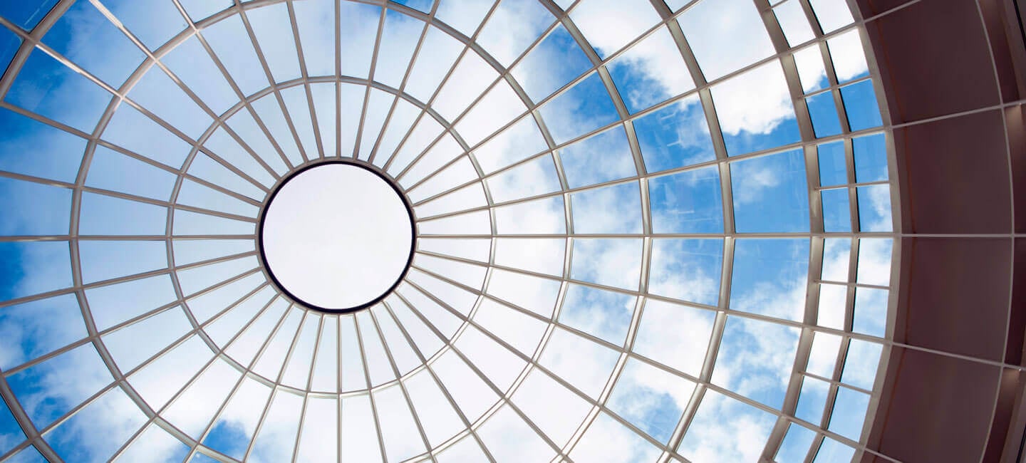 View of the sky through the Lender School of Business Center glass dome